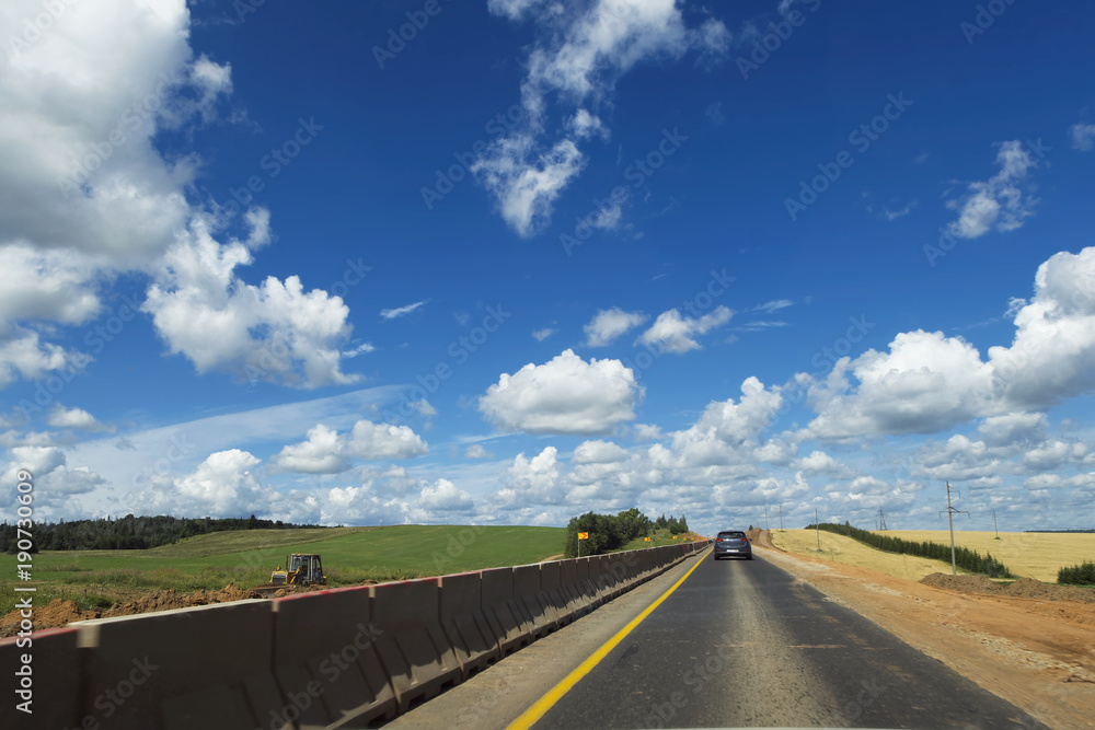 Repair of the highway. The road to the highway is being repaired and protective fencing is installed. Repair of the highway. The road to the highway is being repaired and protective fencing is installed.