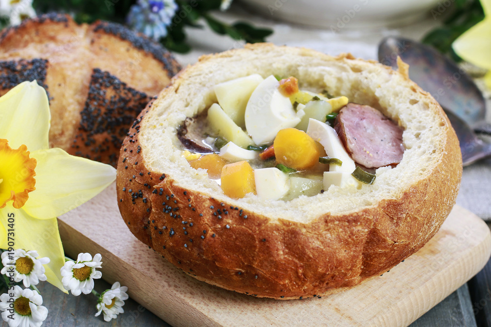 The sour rye soup inside loaf of bread The sour rye soup inside loaf of bread
