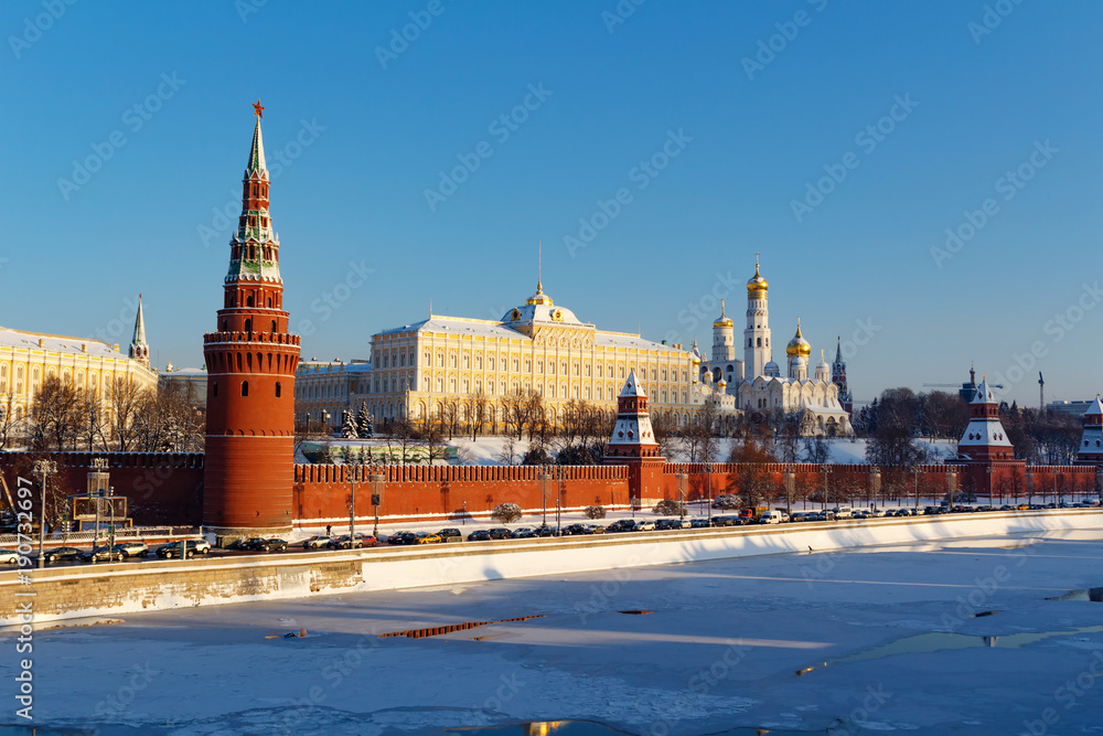 Architectural ensemble of Moscow Kremlin at sunny winter day. Views from the Bol'shoy Kamennyy Bridge Architectural ensemble of Moscow Kremlin at sunny winter day. Views from the Bol'shoy Kamennyy Bridge