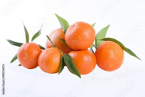 The fresh mandarines isolated on white background.