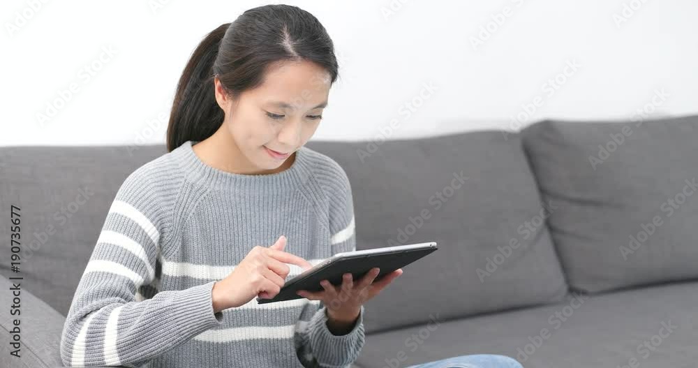 Woman using tablet computer