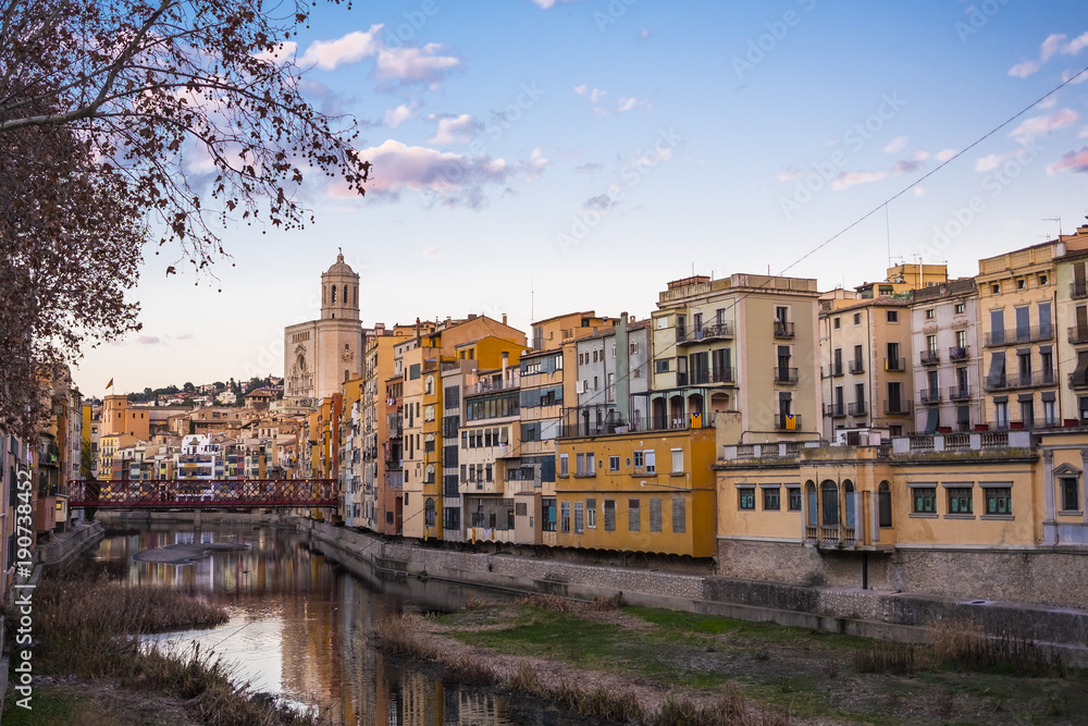 Girona skyline cityscape with river houses reflected