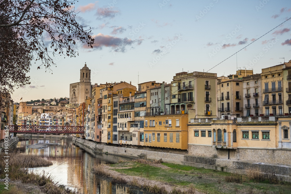 Girona skyline cityscape with river houses reflected
