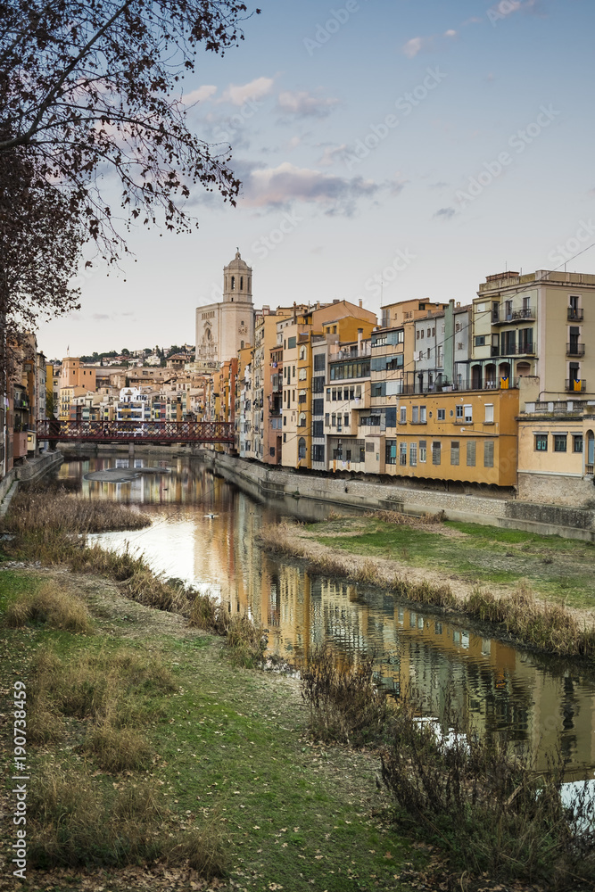 Romanic cathedral main landmark in Girona, Catalonia. Touristic city and main skyline with river houses and reflections