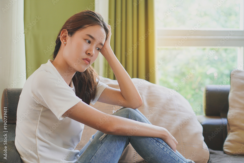 asian teenage feeling depressed and lonely in the house. Stressed female from university study. asian teenage feeling depressed and lonely in the house. Stressed female from university study.
