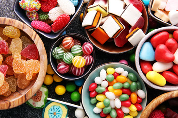 candies with jelly and sugar. colorful array of different childs sweets and treats