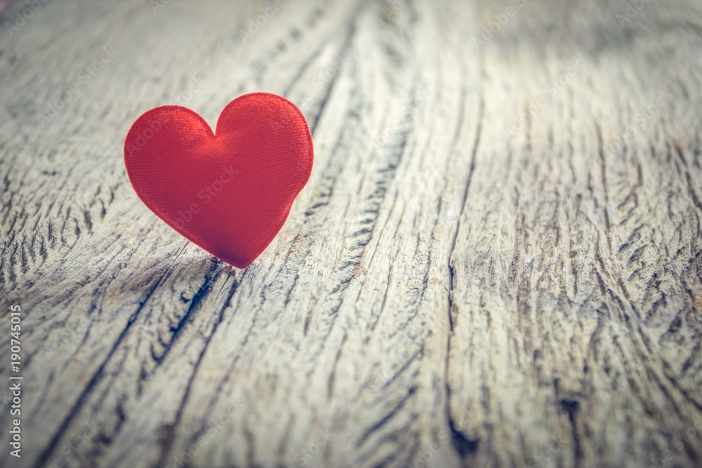 Red heart on wooden floor with copy space for text, used in love concept on Valentine's Day. Red heart on wooden floor with copy space for text, used in love concept on Valentine's Day.