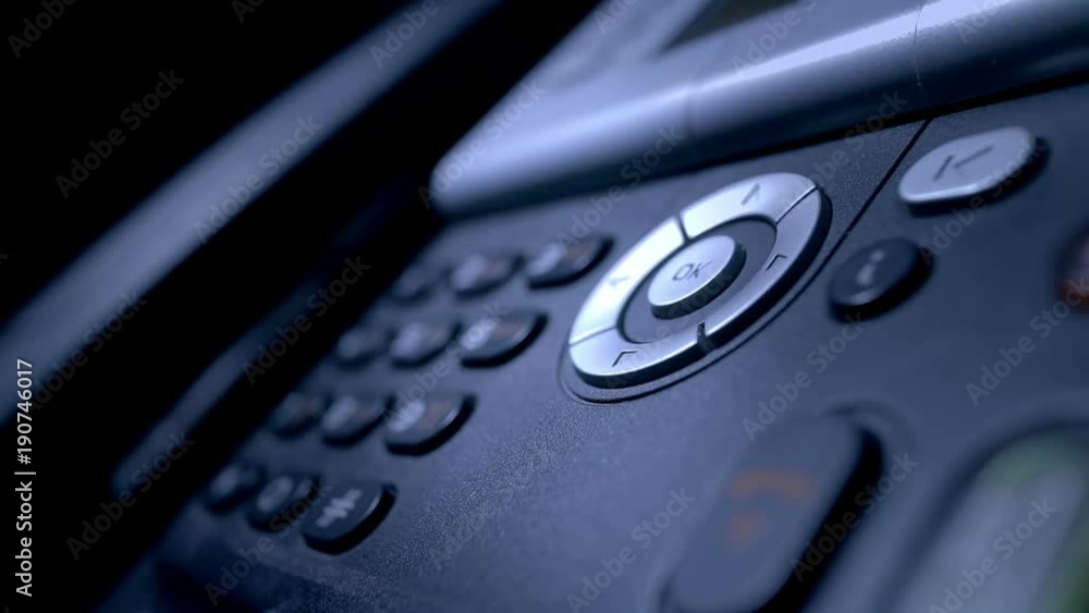 The analog phone is extremely close-up. The sales manager dials the customer's number. The analog phone is extremely close-up. The sales manager dials the customer's number.