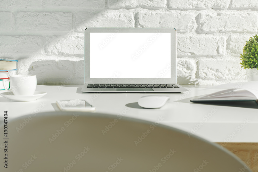 Creative modern desktop with white laptop Creative modern desktop with white laptop