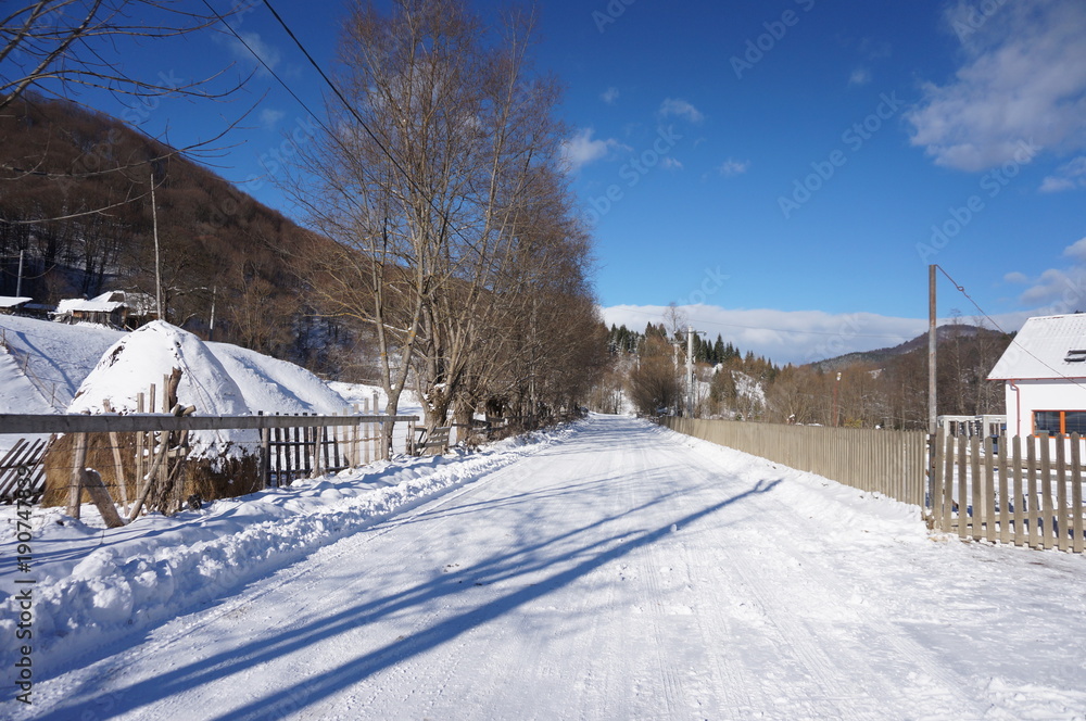 Snowy mountain landscape with road