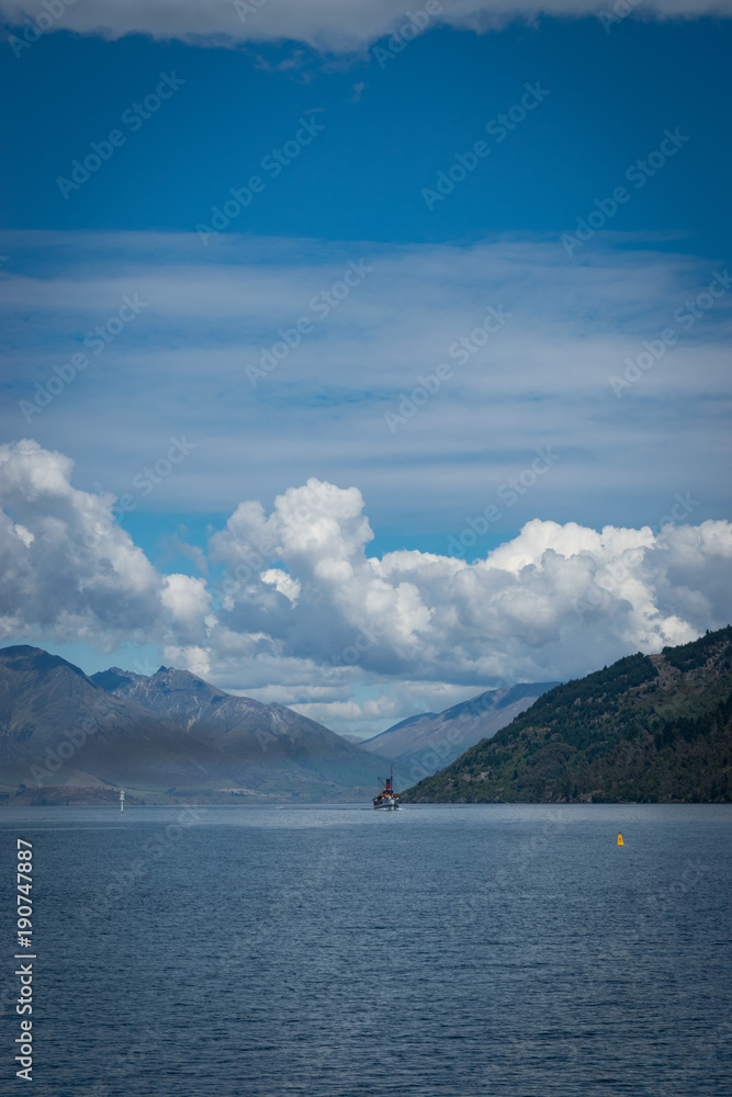 Lake Wakatipu in Queenstown (New Zealand) with steam boat in the distance