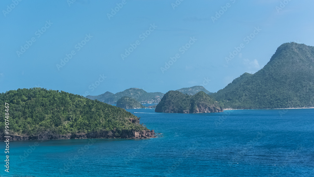 Guadeloupe, beautiful seascape of the Saintes islands, typical houses and sailboats in the marina
