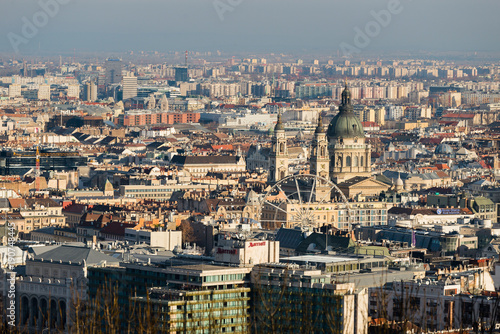 Budapest cityscape with St. Stephen's Basilica and Budapest Eye as seen from Gellert Hill in Budapest, Hungary