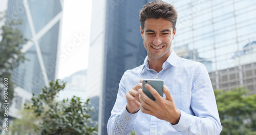 Photography Man use of mobile phone in city