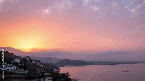 Amazing timelapse of sun rising over mediterranean seacoast of south Spain photo