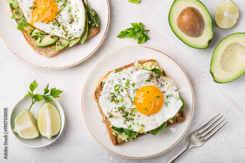 toast with avocado, spinach and fried egg photo