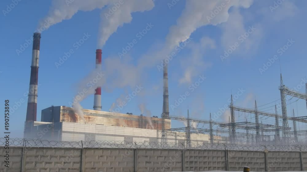 Smoke stack over blue sky background. Energy generation and air environment pollution industrial scene, thermal power station 4K UHD video footage. Smoke stack over blue sky background. Energy generation and air environment pollution industrial scene, thermal power station 4K UHD video footage.