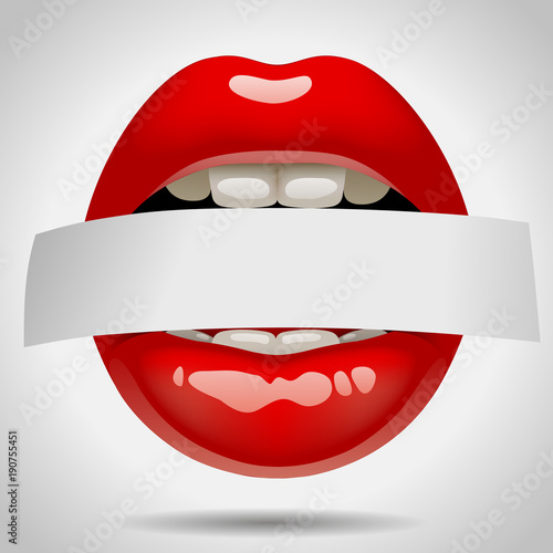 Female sexy gloss red lips with a paper ribbon in the teeth