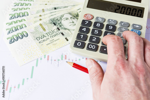 Obraz na plátně Calculator with green czech money on economic charts