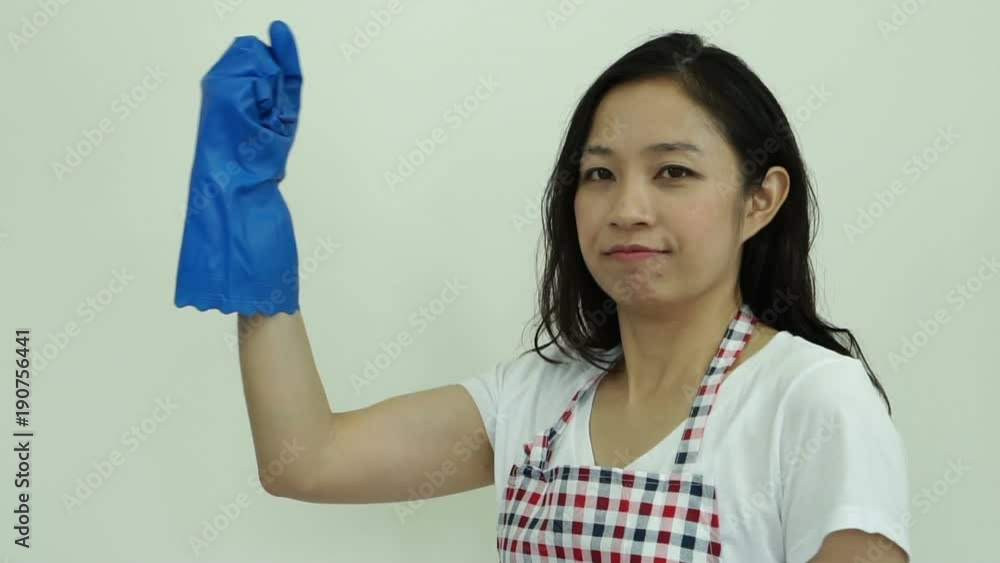 Asian woman happy and set her mind on cleaning duty Asian woman happy and set her mind on cleaning duty