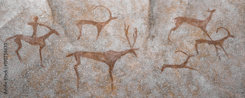 hunter is a historical animal depicted on the wall of a cave. archeology.