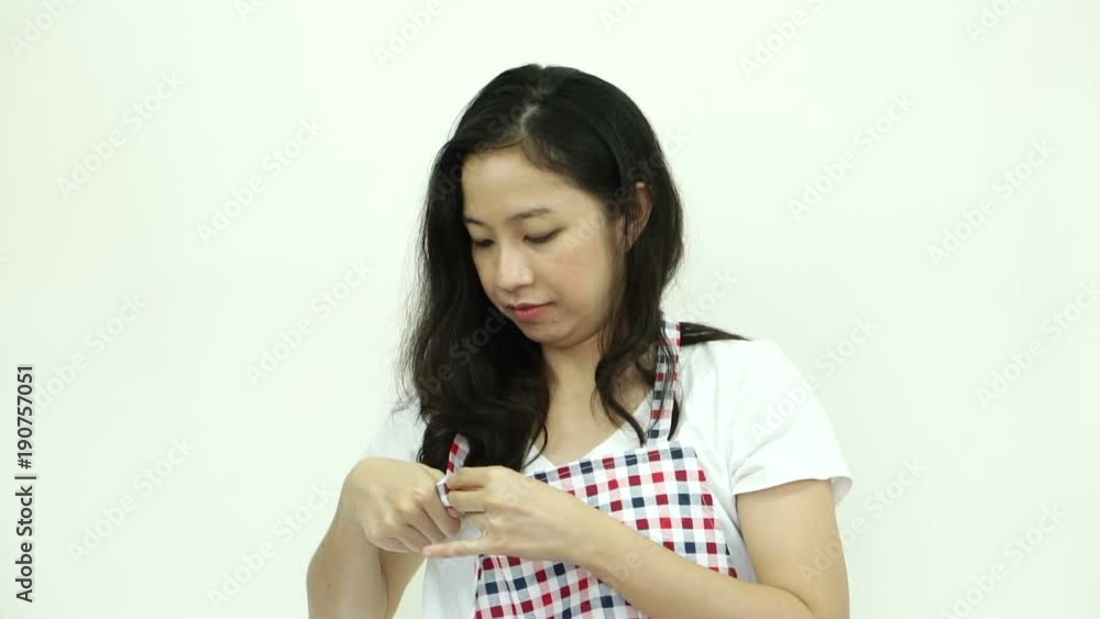 Asian woman wearing apron ready for housework Asian woman wearing apron ready for housework