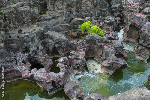 Naturally created potholes (tinajas) on the riverbed of the Kukadi River, Nighoj photo