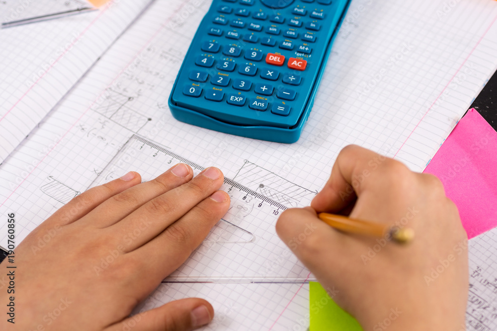 Schoolboy Hands with Ruler Drawing on White Paper. Mathematics Concept. Schoolboy Hands with Ruler Drawing on White Paper. Mathematics Concept.