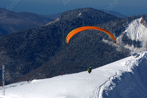 paragliding in the mountains in winter