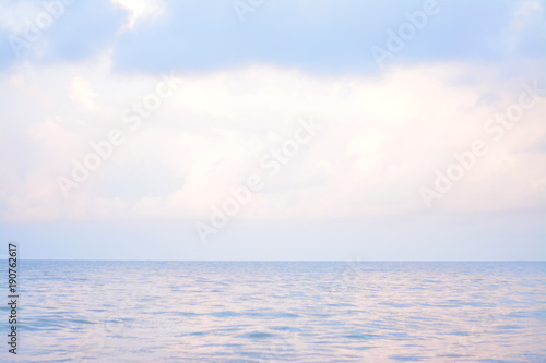 Deep blue and pink sea with cloudy.