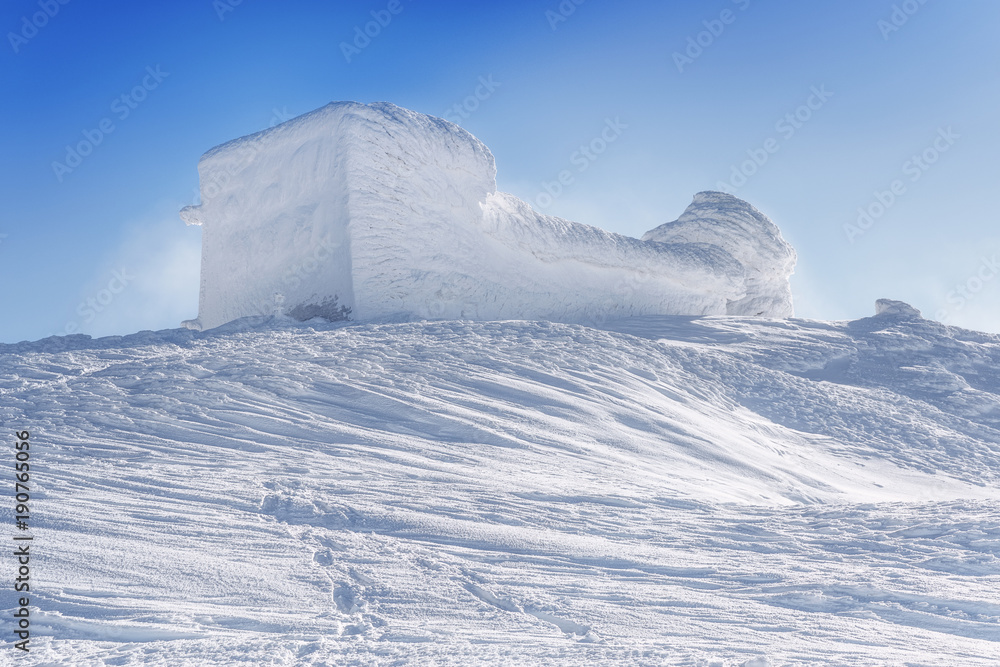 Snow caped Old observatory at the summit of mountain Pip Ivan (2026 m) in Chernogora mountain chain of Ukrainian Carpathian mountains. Winter scenery. Snow caped Old observatory at the summit of mountain Pip Ivan (2026 m) in Chernogora mountain chain of Ukrainian Carpathian mountains. Winter scenery.