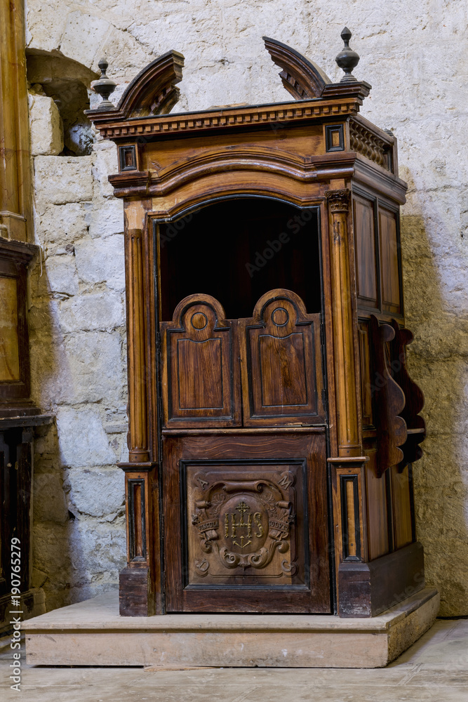 Ancient confessionals, inside a Catholic church