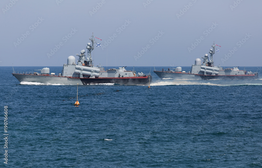 Two naval ships floating in sea