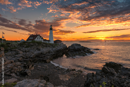 Sunset at Portland Head Lighthouse in Cape Elizabeth, Maine, USA. One Of The Most Iconic And Beautiful Lighthouses.