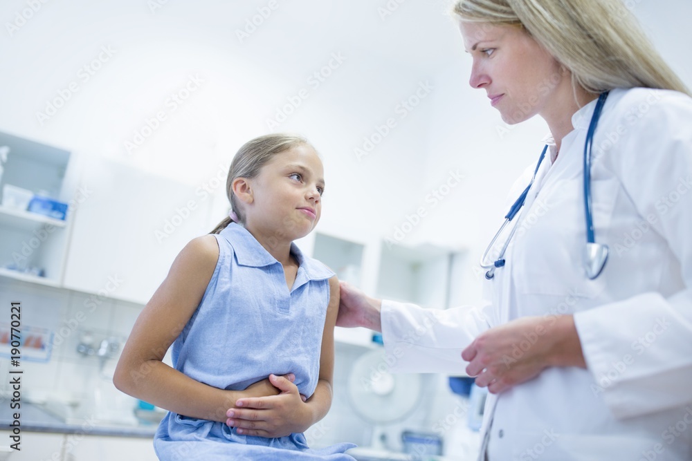 Girl clutching tummy