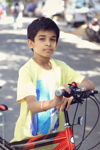 Indian Cute Boy with Cycle