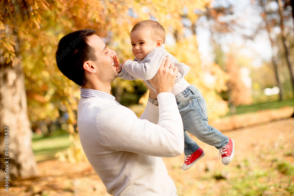 Young father and baby boy in autumn park Young father and baby boy in autumn park