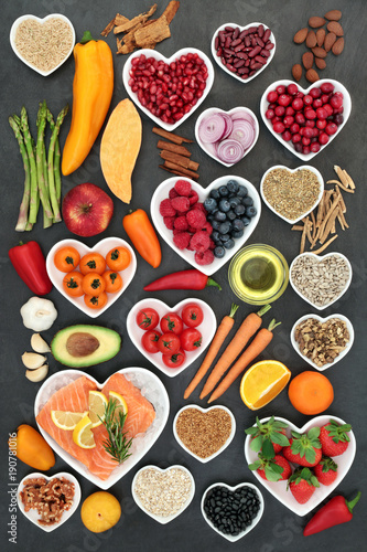 Food for a healthy heart with fruit, vegetables, fish, nuts, seeds, pulses, cereal, medicinal spices and herbs. Super food very high in omega 3, antioxidants, anthocyanins, fibre and vitamins.