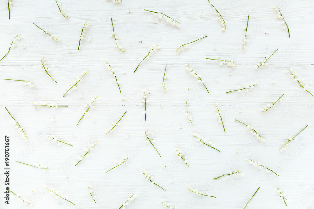 texture of lilies of the valley on wooden white background