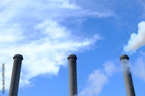three chimneys and blue sky