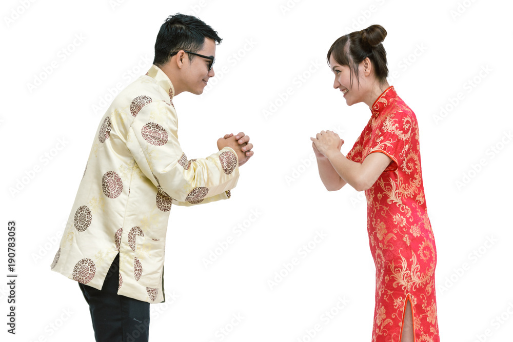 Young chinese new year couple. isolated background with clipping path Young chinese new year couple. isolated background with clipping path