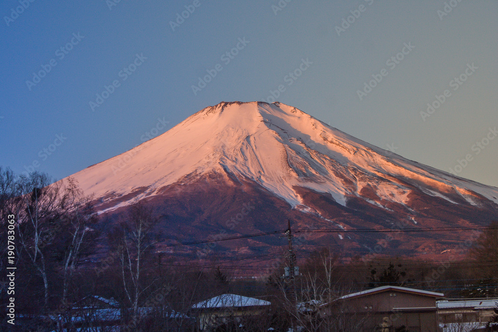 Fototapeta premium Beautiful landscape view of Fuji mountain or Mt.Fuji covered with white snow in winter seasonal at Yamanaka Lake, Japan.