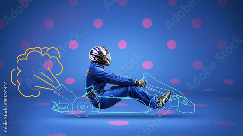 racer in painted racecar on polka-dot background