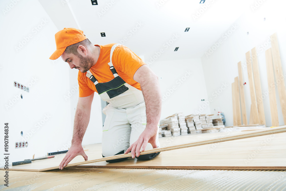 worker joining parket floor. slow motion worker joining parket floor. slow motion