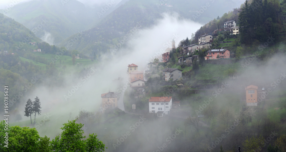 Fototapeta premium Alpine village in cloudy weather