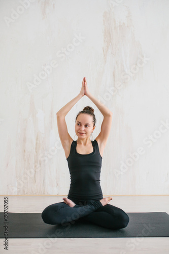 Young beautiful woman practicing yoga and gymnastic. Wellness concept. Classes in single sports.