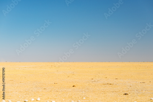 Kalahari desert, salt flat, no where, empty plain, clear sky, road trip in Botswana, travel destination in Africa.
