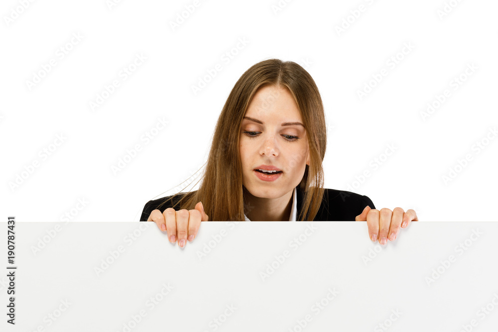 Young attractive girl peeking behind blank board on white background Young attractive girl peeking behind blank board on white background
