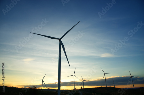 Wind generators turbines at sunset : Khao Kho mountain, Thailand. Renewable energy concept.