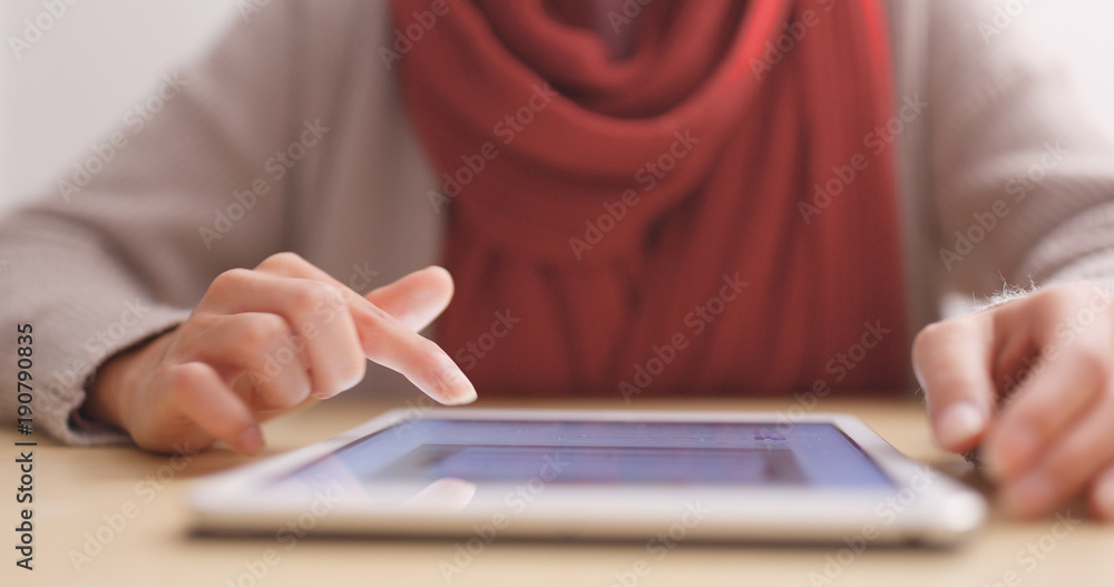 Fototapeta premium Woman touch on tablet computer on table